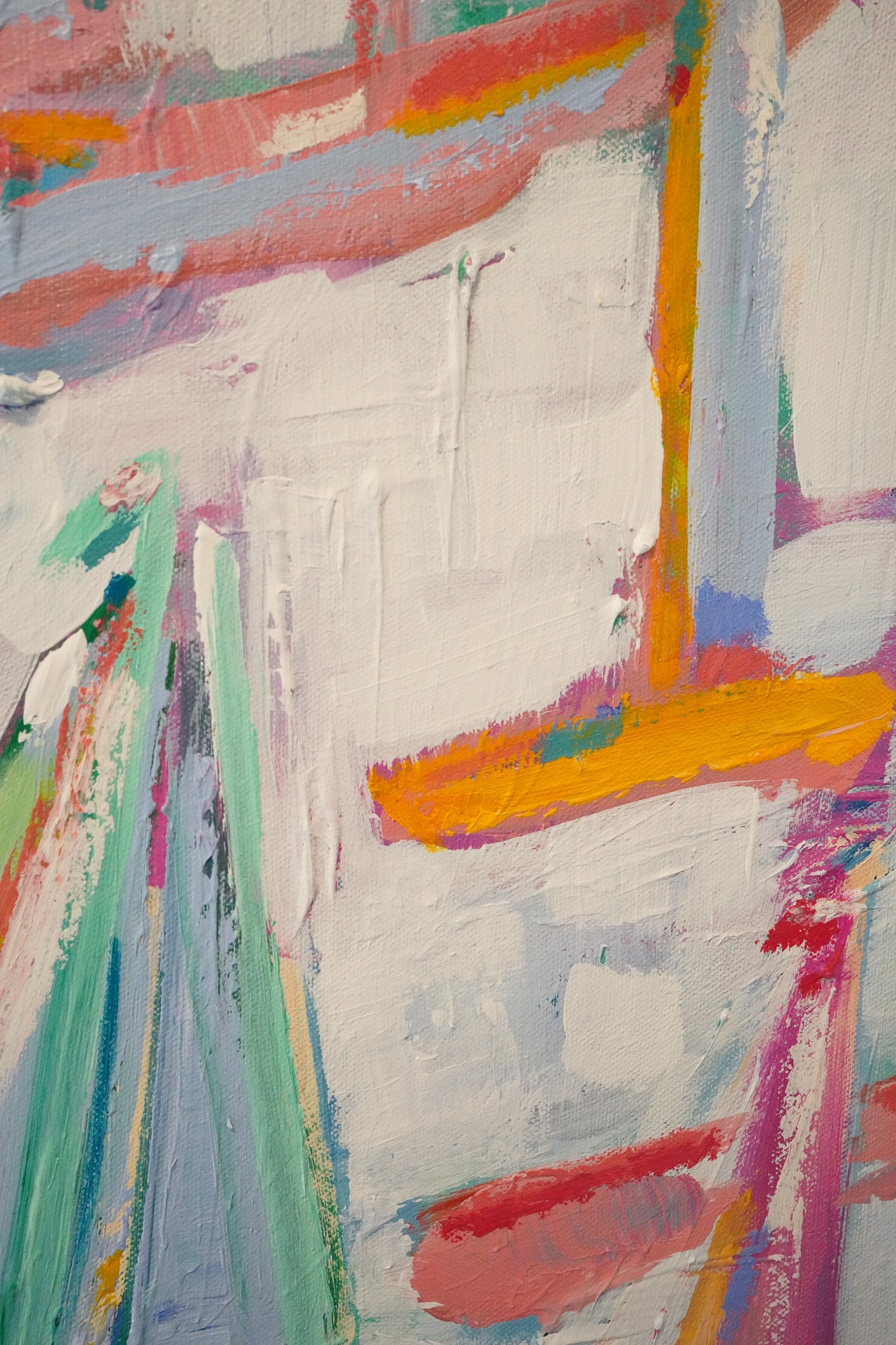 An up close photo of a larger acrylic and oil pastel painting depicting many sailboats in an abstract style. Thick brush strokes and lots of layers create a dynamic and interesting canvas. Vibrant hues of peaches, pinks, oranges, greens and blues are shown.