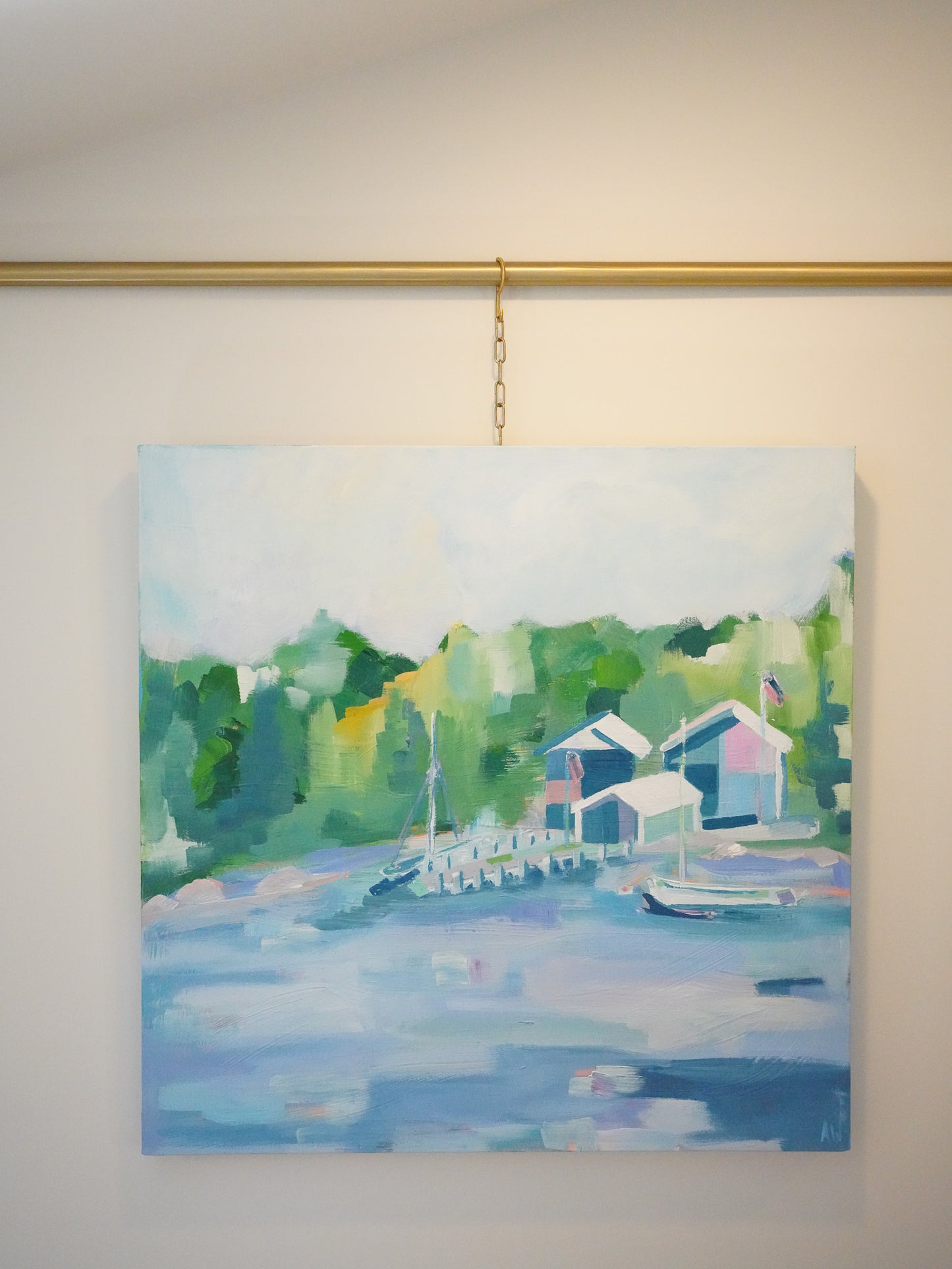 Tranquil painting titled Les Cheneaux featuring boathouses and docks along calm waters, surrounded by lush greenery, inspired by Michigan’s Upper Peninsula.