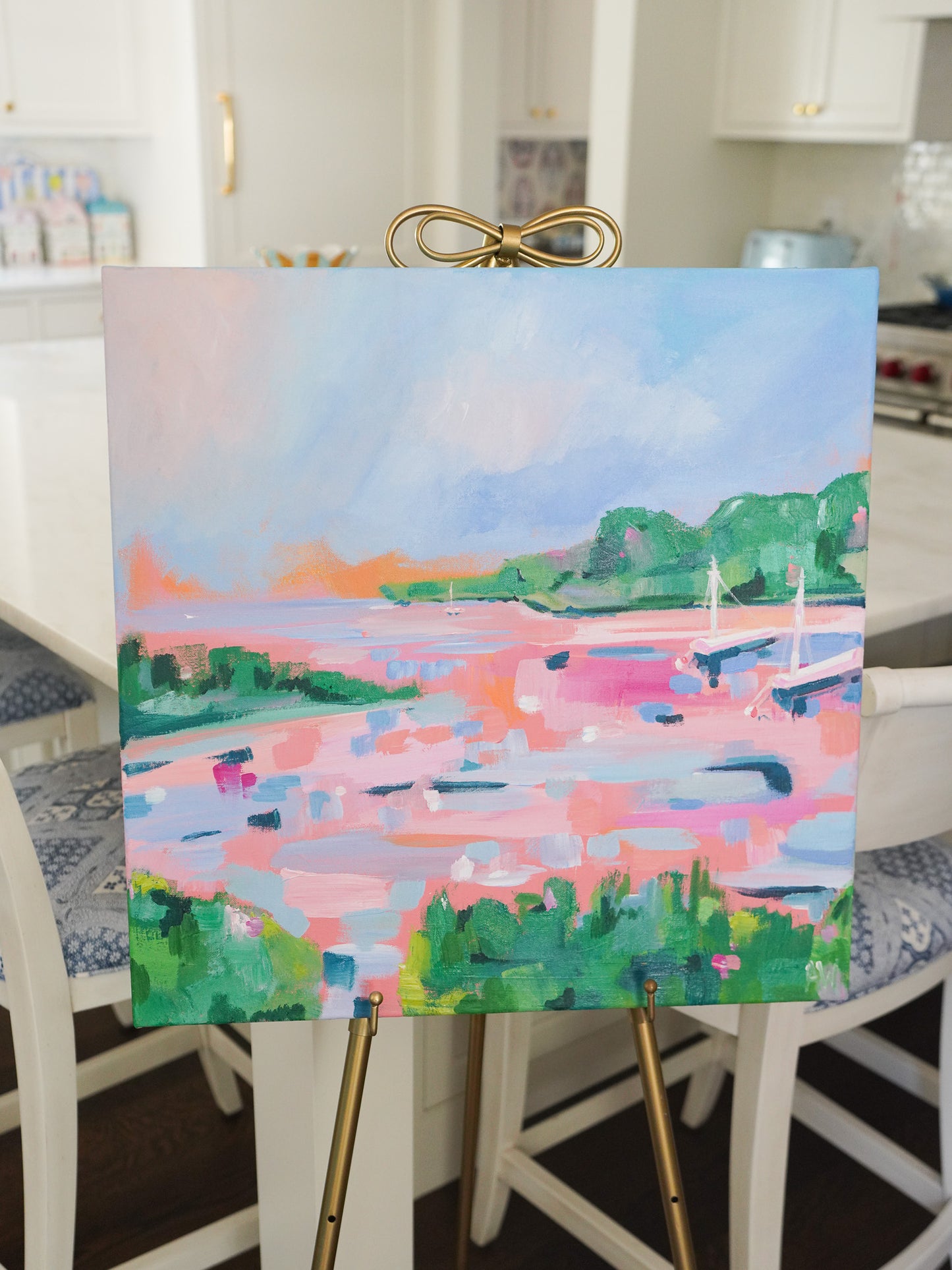 Abstract painting titled The Cape inspired by Northern Michigan at golden hour, featuring vibrant pinks, greens, and blues depicting a lakeside scene at sunset.